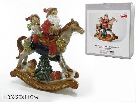 Babbo natale su cavallo a dondolo con bimbo Online now